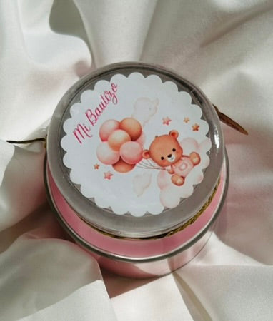 Vela rosa en tarro con etiqueta